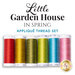 A set of six spools of colorful thread labeled Little Garden House in Spring for appliqué.