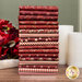 A stack of red, cream, and white fabrics included in the Garnets & Gingham collection