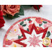 A shot of half of the round potholder, staged with roses on a white countertop.