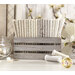 floral fabrics in lovely shades of cream and beige, stacked in a wood basket