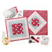 Image of two project bags on a white background with sewing notions scattered around, each one with a differently quilted square on the back made with the My Summer House fabric collection.