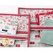 A close up on the bags, demonstrating zipper and fabric details while also demonstrating the use of the pockets which hold fat quarters and a charm pack.