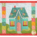 Close up of one block from the "Welcome Home in Spring" quilt showing a beautiful teal house with shutters and a scalloped white roof.