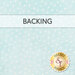 Pastel aqua fabric with a light white polka dot pattern; a banner reads 