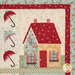 A close up on one of the blocks, showing fabric and stitching detail on a multicolor cottage bordered by umbrellas.