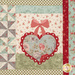 A close up on one of the blocks, showing fabric and stitching detail on a detailed heart with a bow, embellished with white buttons.