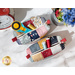 A top down shot of the two vintage mini charm bags holding various notions, staged on a white marble countertop with matching decor.