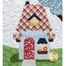 A close up on a block featuring a blue house with a red plaid roof adorned with baskets of flowers.