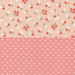 Split fabric showing floral pattern on the left with red and white flowers, and pink polka dots on the right.