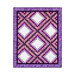 A shot of the full and completed Irish Chain quilt in bright purples, pinks, and white, isolated on a white background.