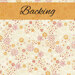 Swatch of a cream fabric with tossed, whimsical star and flower motifs in orange, pink, and white. A tangerine banner at the top reads 