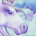 A close-up of a colorful unicorn's face against a dreamy blue and cloud-filled background.