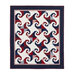 The completed Snails Trail quilt, colored in navy, burgundy, and creamy white, isolated on a white background.