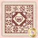 A patchwork quilt design featuring various geometric patterns in shades of red, pink, and cream, with a central diamond-shaped motif adorned with a bow. The quilt is bordered by a decorative floral pattern. A logo for Shabby Fabrics is in the bottom right corner.