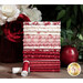 A stack of the fabrics in the Red Delicious 16 FQ set in shades of red and white, with flowers, thread, and an apple.