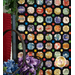 A close up on the collage prints on the side of the I Spy Quilt, demonstrating color variety and sashing details.