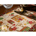 A super close up on one of the placemats, demonstrating the cute Santa and house print.