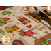 A super close up on one of the placemats, demonstrating the cute Santa and house print.