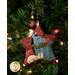 A close up on the ornament featuring a donkey and a cat, showing detail on the clay holly button embellishments.