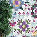 A shot of the left side of the quilt, next to coordinating foliage.