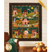 The completed Welcome Home in Autumn quilt colored in deep autumnal colors, hung on a paneled wall and staged with coordinating fall décor.