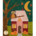 A close up on one of the houses on the quilt, showcasing fabric, appliqué, and embellishment details.