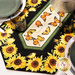 A close up on the table runner, demonstrating color and fabric details on the sunflower and butterfly prints.