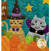 A super close up on the witch and vampire kitties in the kitty pumpkin patch block, showing fabric, stitching, and laser cut shape details.