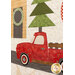 A close up on the Homemade Quilt featuring a red vintage pickup truck with a Christmas tree in the bed, parked on a road in front of a house. The background includes a decorative wreath hung on the door and top quilting details across the whole quilt.