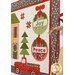 A decorative quilt featuring a red truck, a green tree, a house, and two Christmas tree ornaments with the words Joy and Peace. The background includes small snowflakes and red sawtooth stars, creating a festive atmosphere.