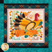 A super close up on one of the panel blocks, featuring a large turkey standing in a pumpkin patch over the words 