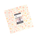 A fabric bundle with a floral design in pastel colors, featuring a label from Moda Fabrics.