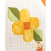 A super close up on a patchwork yellow flower, showing fabric and topquilting details.