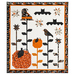 The completed Halloween Garden quilt in white, black, and orange, isolated on a white background.