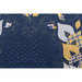 A dark blue quilted fabric with yellow and white leaves