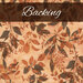 A swatch of orange batik fabric with tonal golden tan and brown mottled leaves. A brown banner at the top reads 