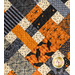 A super close up on the criss cross design of the picnic quilt in black, gray, orange, and cream, showing fabric and stitching details. Stitched pumpkins can be seen across the fabric.