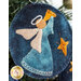 A super close up on the angel wool ornament, demonstrating fabric, applique, and stitching details.