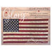 The front of the Glory pattern featuring an American flag with 13 stripes and 50 stars, featuring embroidered names of the states organized in the order they joined the Union. The background includes a wooden texture.