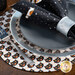 An angled close up of the black cat placemat set with plates and silverware topped by a coordinating Witching Hour cloth napkin.