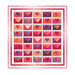 A digital mockup of the completed quilt, rows of love letters in bright ombre Valentine's day colors, isolated on a white background.