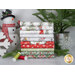 A stack of fabrics available in The Christmas Mouse Flannel fq set, with a tree and snowflakes and a snowman and thread.