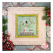 A decorative framed cross stitch project featuring a colorful snowman in a snowglobe, amid snowflakes and holiday decorations.