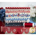 Collage of red, white, and blue fabrics stacked on top of one-another from the Star-Spangled Beauty Fat Quarter Bundle.