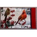 A fabric panel with two cardinals among red berries and snow, with dimensions and finishing details below the image.