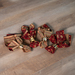 A top down shot of the four napkins slightly fanned out on a wood table top.