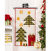 The completed Christmas Eve door banner, colored in cream, olive green, yellow, and crimson red fabrics, hung on a white wall from a craft hanger and staged with coordinating decor.