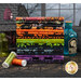 A stack of fabrics from the Tonga Haunted collection with jars and a haunted house and thread.