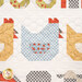 A super close up on one of the pieced hens of the quilt, colored in various blue prints with gingham and cherries.