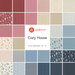 A collage of the red, blue, cream, and light tan fabrics included in the Cozy House fat quarter set.
